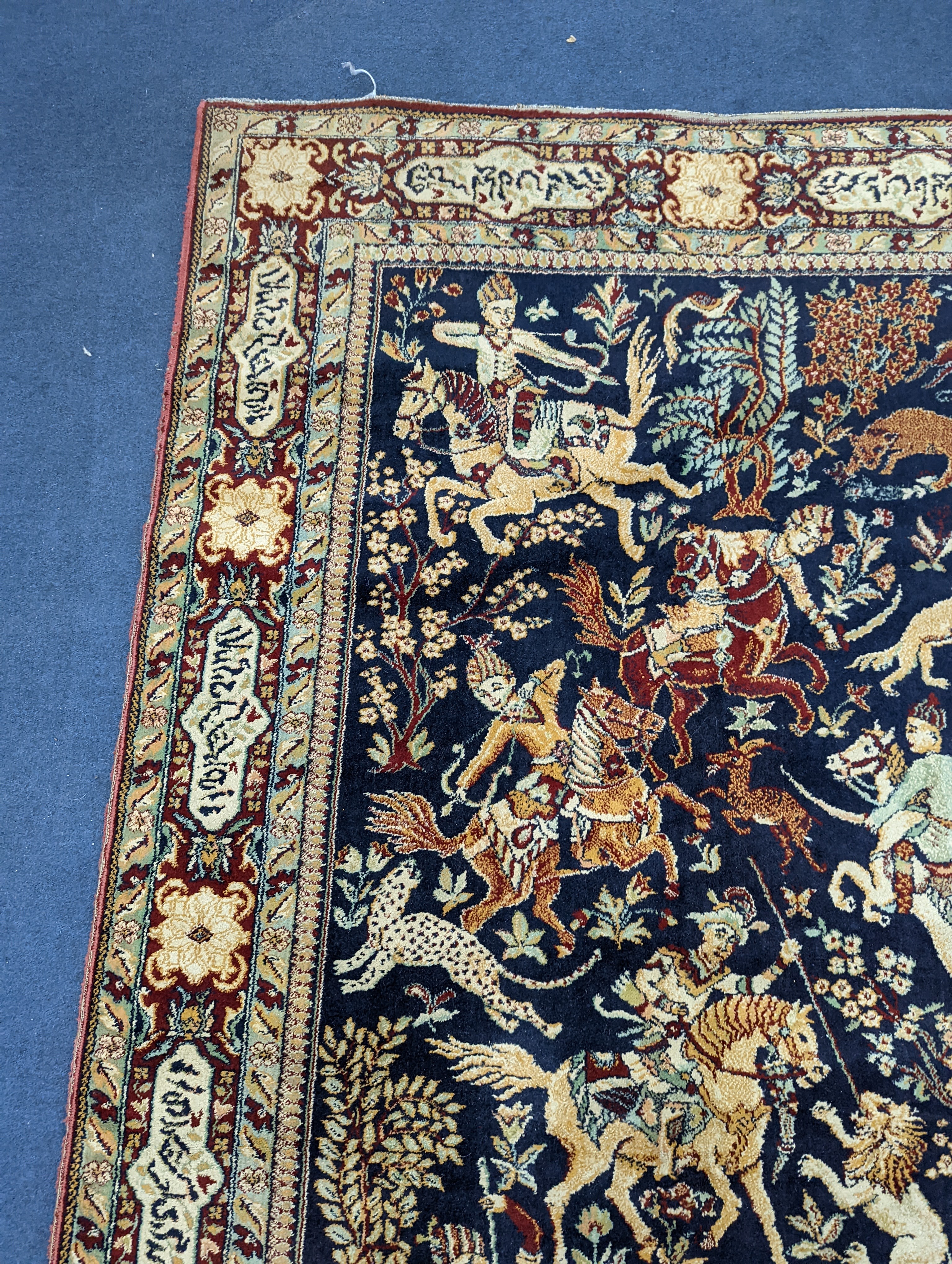 A Kashan style blue ground pictorial rug, 224 x 144cm